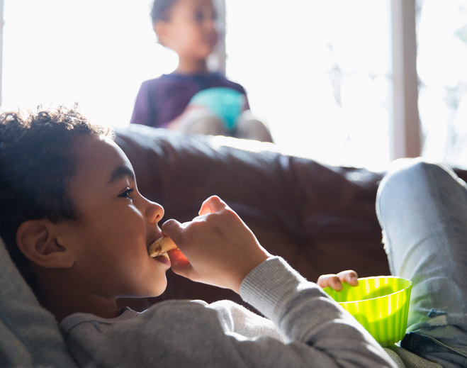 Boy eating cookie